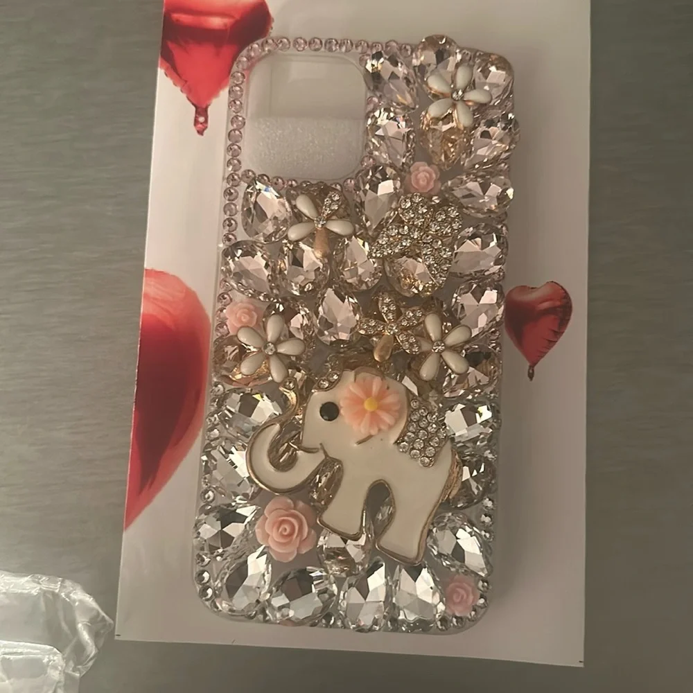 I phone 12 Pro protective cover.pink stones, white enamel flowers & elephant NWT